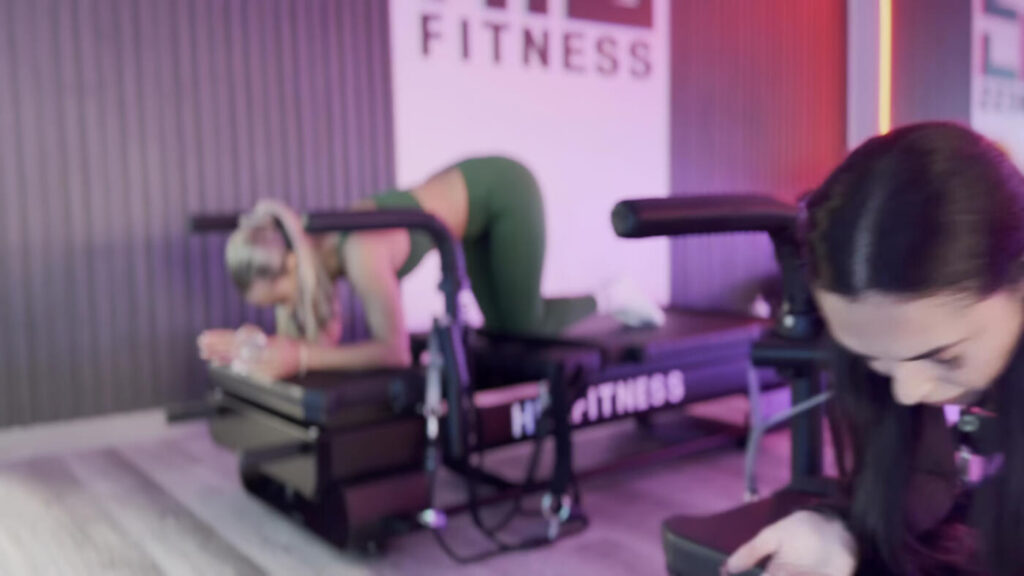 Members training on XFormer pilates machines at HILI Fitness Lake Nona