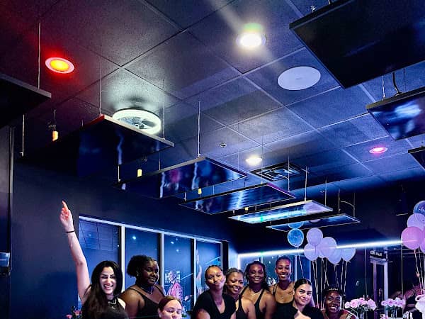 Group of members gathered in the pilates studio at HILI Fitness Lake Nona