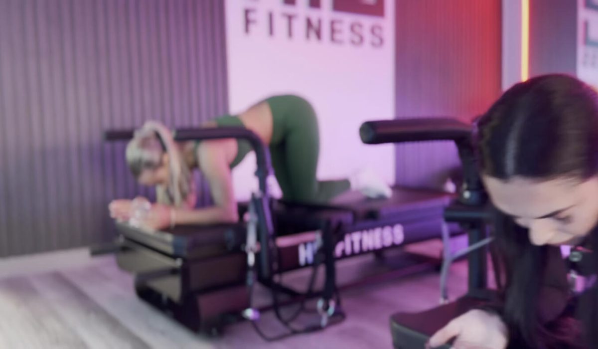 Members training on XFormer pilates machines at HILI Fitness Lake Nona